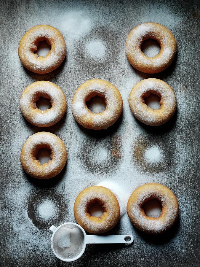 Doughnuts Dusted With Icing Sugar Photograph by Joff Lee
