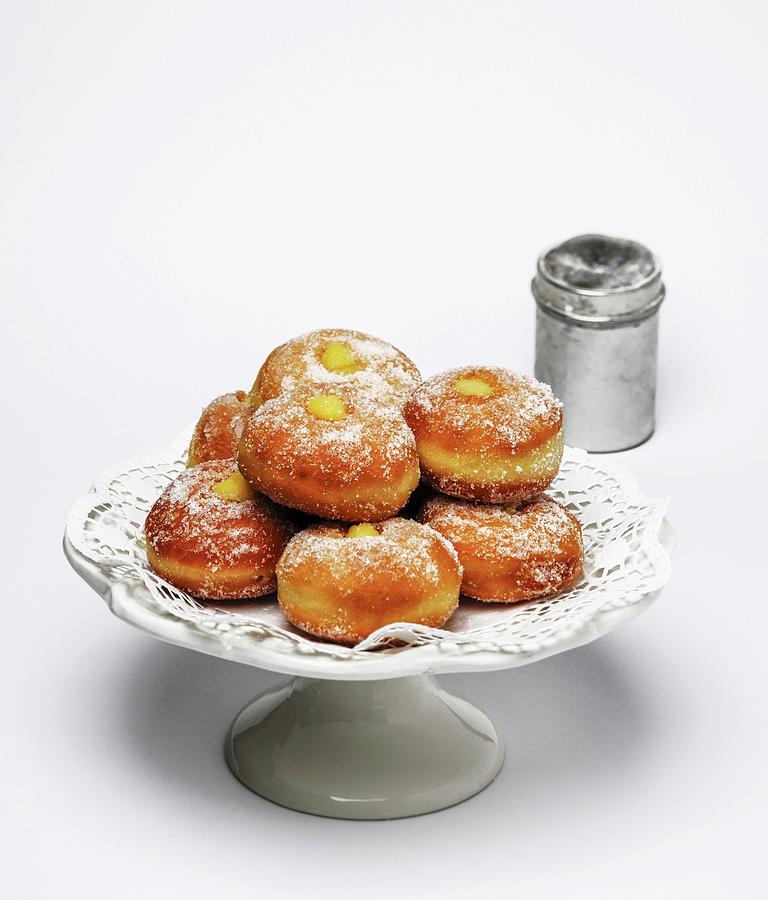 Doughnuts Filled With Vanilla Cream And Dusted With Icing Sugar Photograph by Paolo Della Corte
