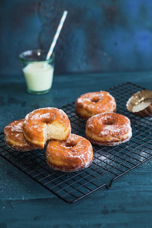 Doughnuts On A Cooling Rack Photograph by Aniko Takacs