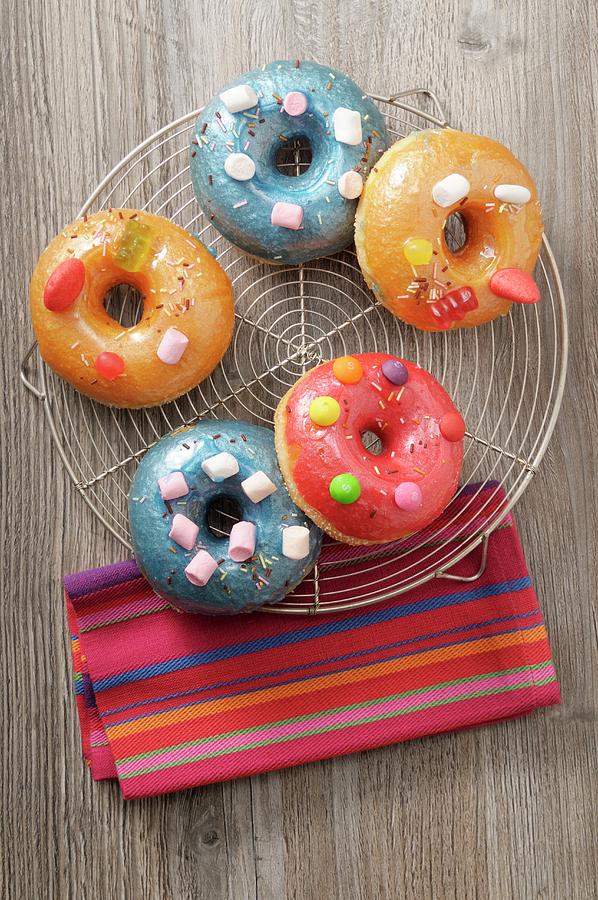 Doughnuts With Coloured Sugar Glaze Photograph by Jean-christophe Riou