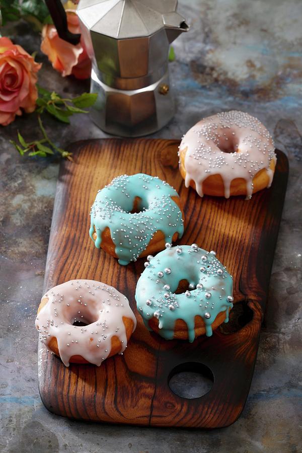 Doughnuts With Colourful Icing And Silver Sugar Beads Photograph by Boguslaw Bialy