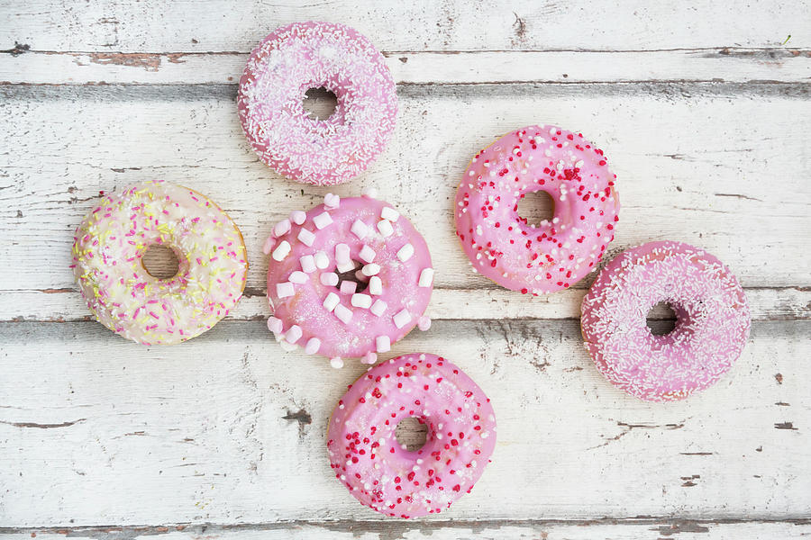Doughnuts With Pink Sugar Glaze And Sugar Decorations Photograph by Larissa Veronesi