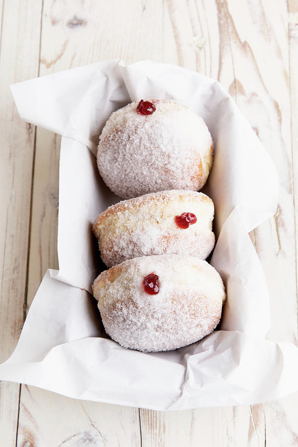 Doughnuts With Strawberry Jam And Powdered Sugar Photograph by Sylvia Meyborg