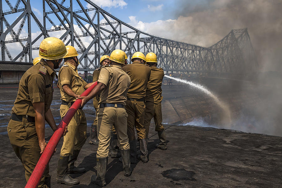 Bridge Photograph - Dousing The Raging Smoke by Souvik Banerjee