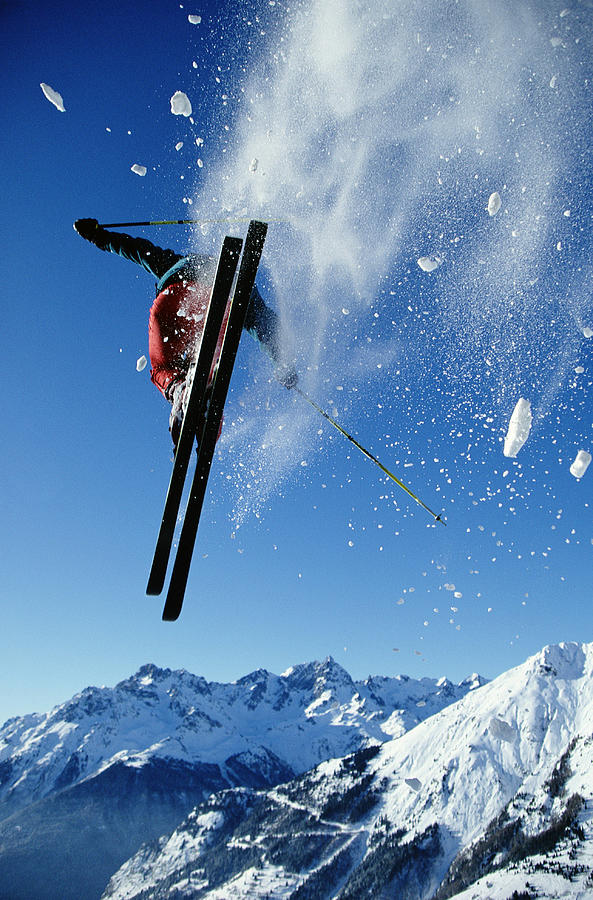 Downhill Skier In Mid-air, Rear View Photograph by Ross Woodhall Downhill Skier In Mid-air, Rear View Photograph by Ross Woodhall