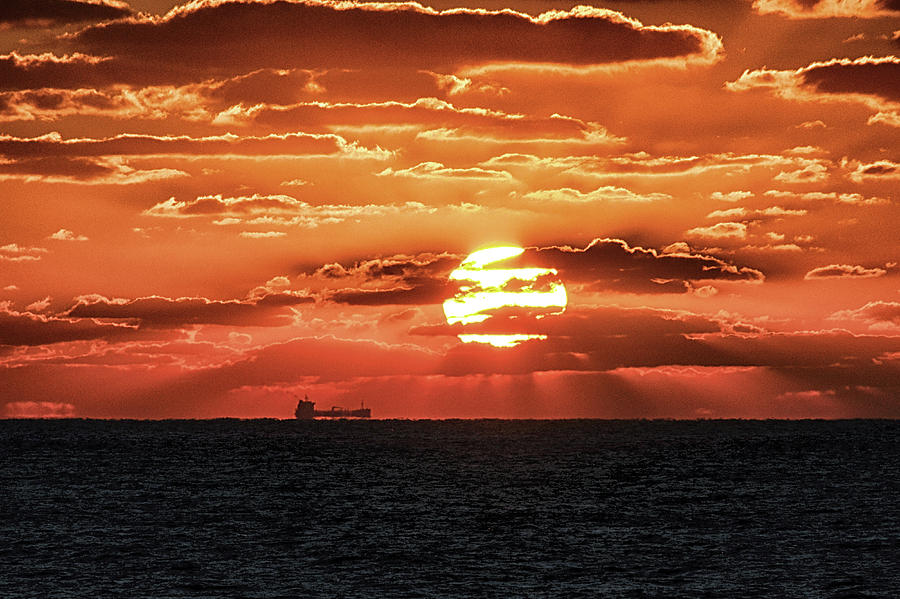 Dramatic Atlantic Sunrise with Ghost Freighter Photograph by Bill Swartwout