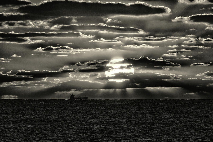 Dramatic Atlantic Sunrise with Ghost Freighter in Monochrome Photograph by Bill Swartwout