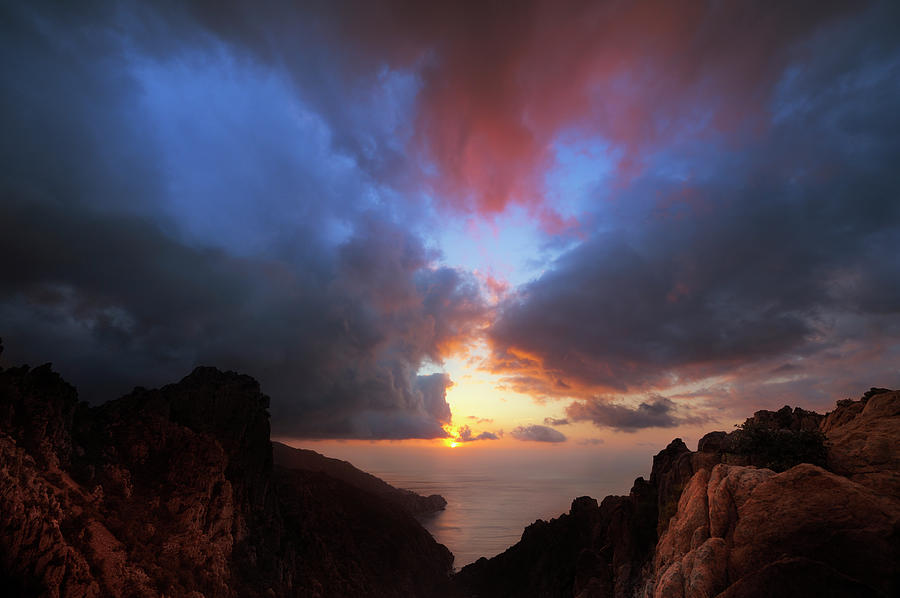 Dramatic Cloudscape Over Rocky Coastline Photograph by Akrp