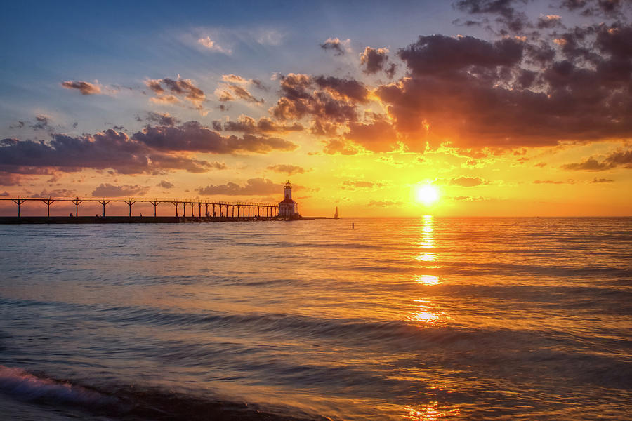 Dramatic Sunset at Michigan City East Pierhead Lighthouse Photograph by Andy Konieczny