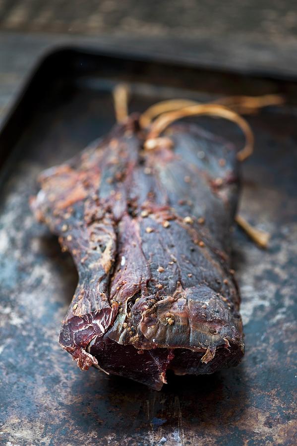 Dried Beef On A Baking Tray Photograph by Gabriela Lupu