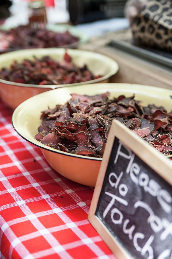 Dried Beef On A Counter In A Restaurant Photograph by Claudia Timmann