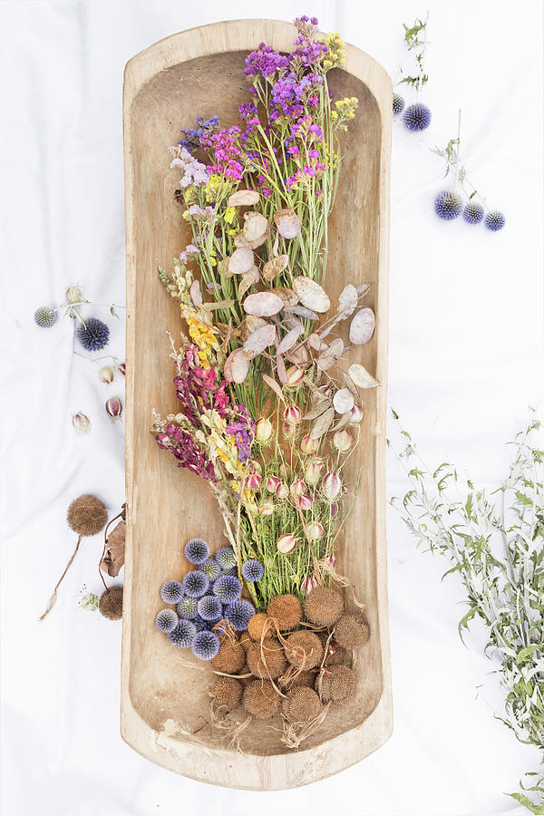 Dried Flowers In Wooden Dish Photograph by Sabine Lscher