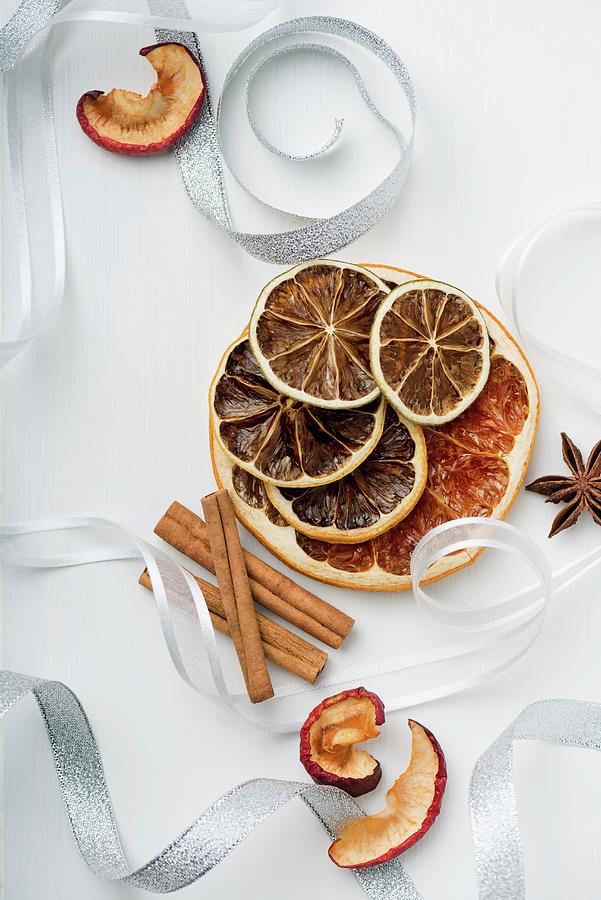 Dried Fruit And Cinnamon Sticks As A Christmas Decoration Photograph by Komar