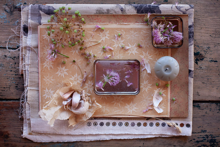 Dried Garlic Flowers, Chive Flowers, Candle And Garlic Bulb Decorating Table Photograph by Alicja Koll