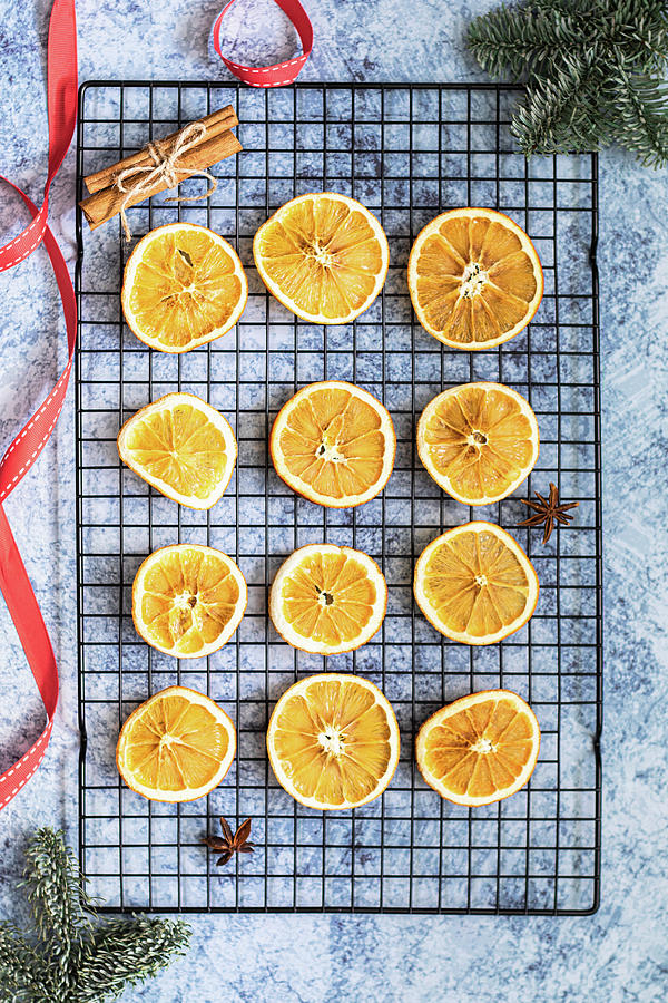 Dried Oranges With Cinnamon Sticks Photograph by Karolina Nicpon