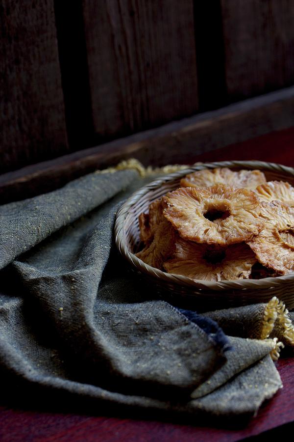 Dried Pineapple Rings In A Basket Photograph by Chaudron Pastel