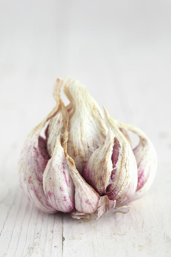 Dried Pink And White Garlic Photograph by Danya Weiner