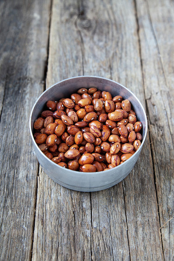 Dried Quail Beans In A Small Bowl On A Wooden Background Photograph by Julia Skowronek