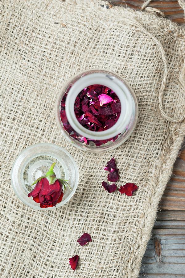 Dried Rose Petals In A Glass Jar seen From Above Photograph by Mandy Reschke