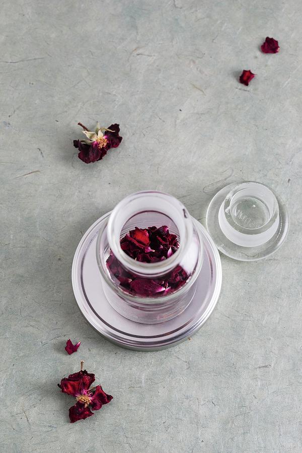 Dried Rose Petals In A Medicine Jar Photograph by Mandy Reschke