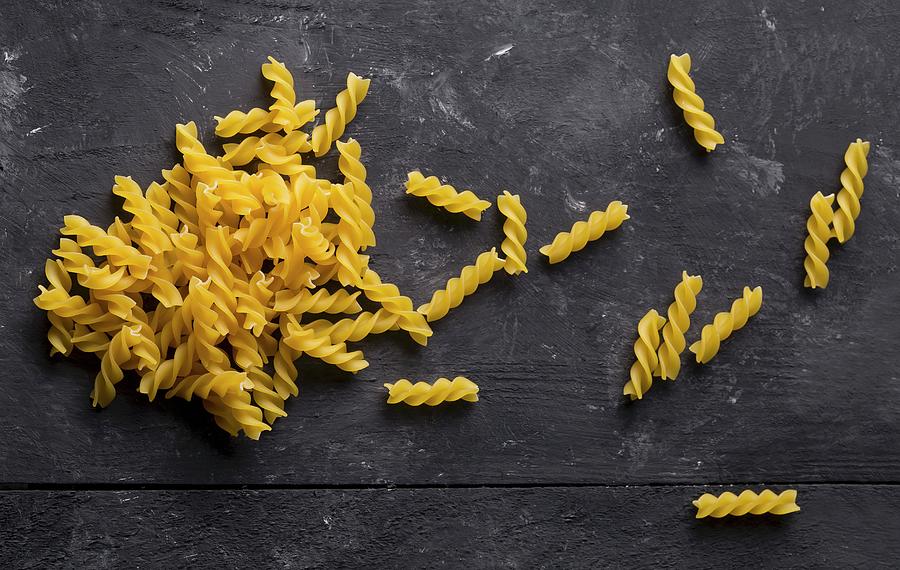 Dried Spirelli Pasta On A Black Background Photograph by Shawn Hempel