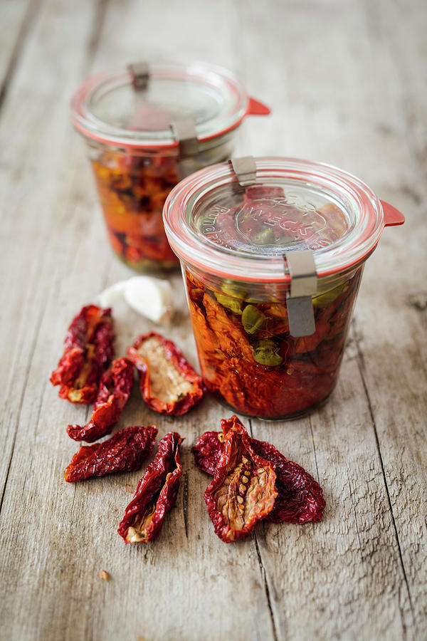 Dried Tomatoes Preserved In Red Wine Vinegar Photograph by Jan Wischnewski