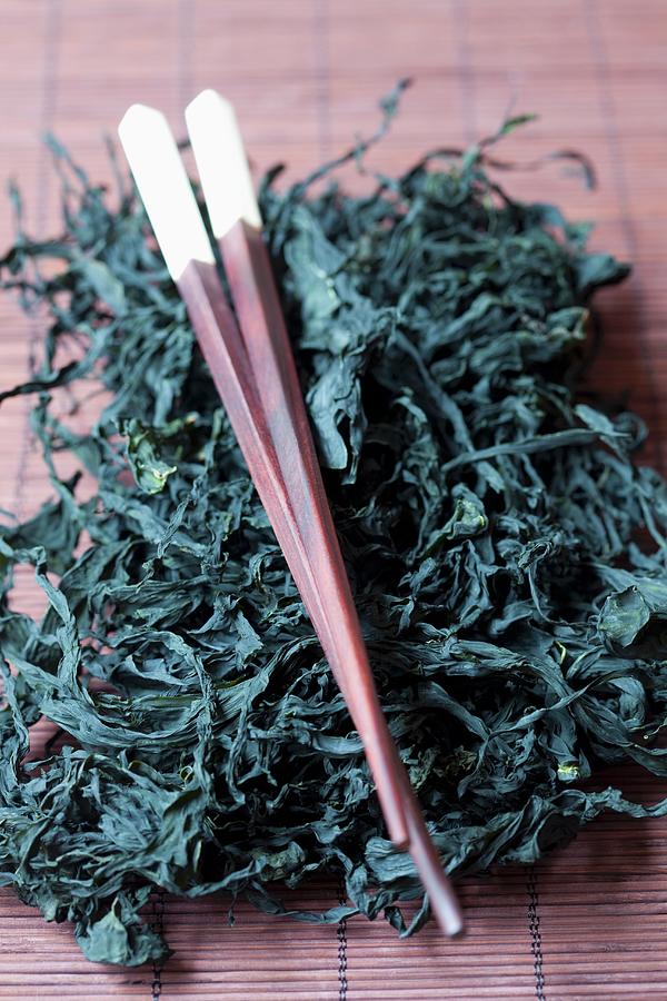 Dried Wakame Seaweed With Chopsticks Photograph by Mche, Hilde