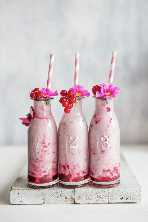 Drinking Berry Yoghurt In A Small Bottles With Fruit Garnish Photograph by Magdalena Hendey