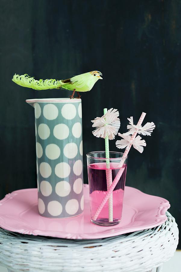 Drinking Straws With Paper Collars And Pink Drink In Glass Photograph by Ulla@patsy