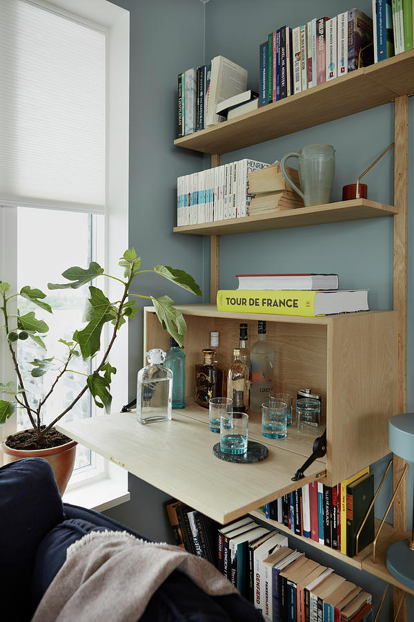 Drinks Cabinet Integrated Into Modern Wooden Shelving Photograph by Bjarni B. Jacobsen