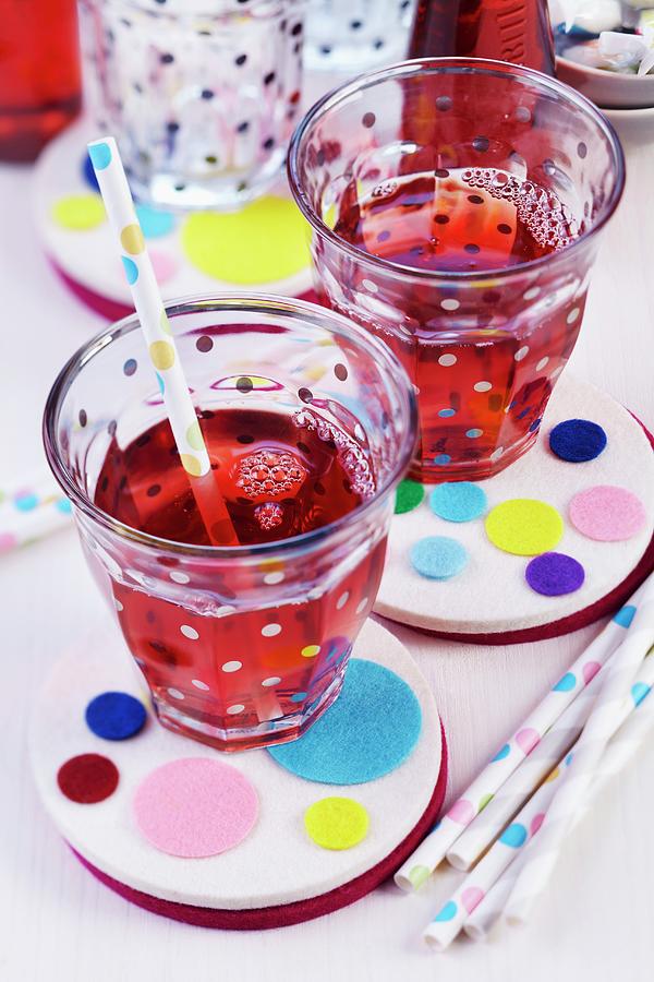 Drinks With Straws On Felt Coasters Decorated With Colourful Felt Circles Photograph by Franziska Taube