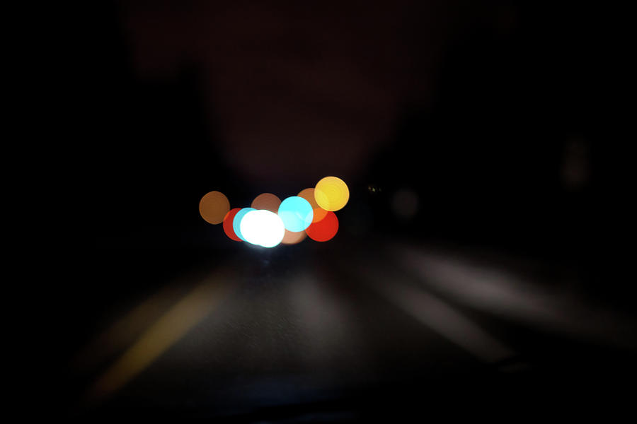 Driving At Night With Colourful Lights Photograph by Allen Donikowski
