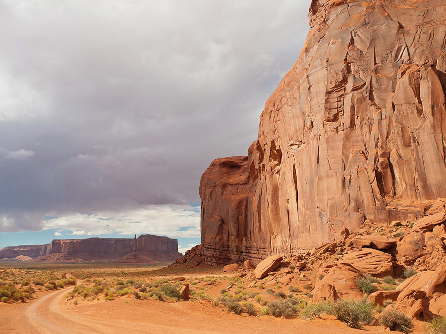 Driving Throe Monument Valley Photograph by Helovi