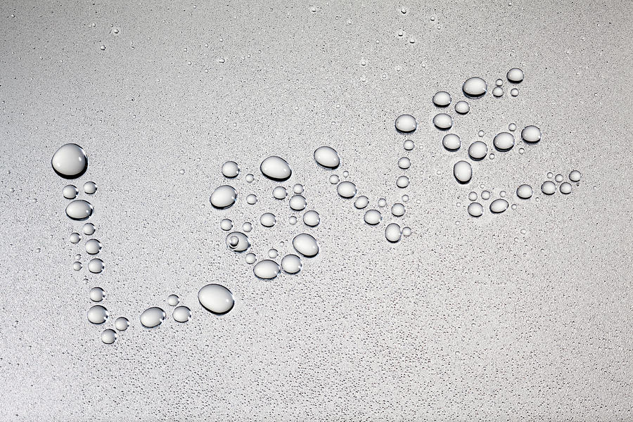 Droplets Of Water That Written Love Photograph by Hiroshi Watanabe