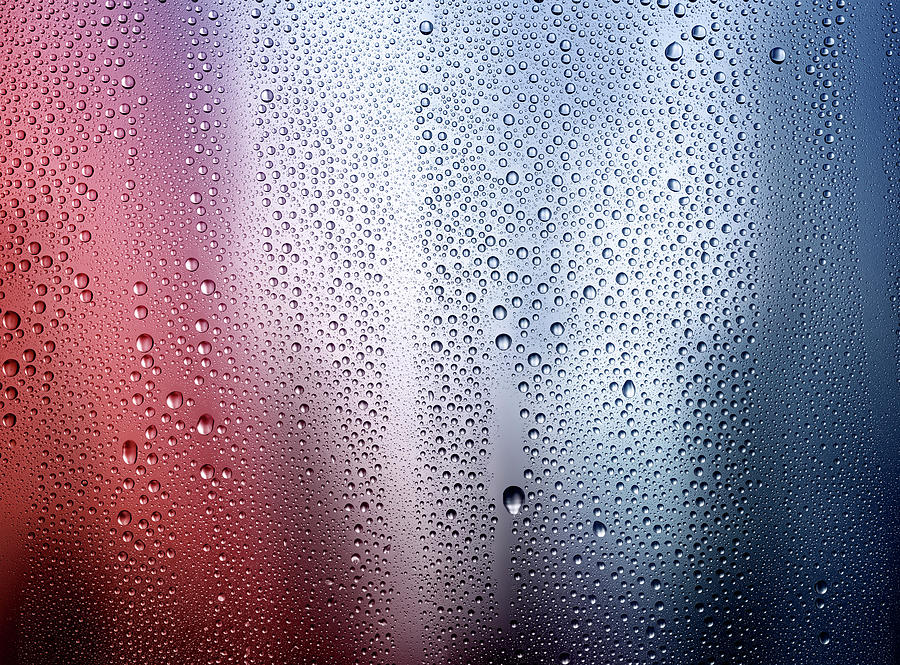 Drops Of Condensation On A Red And Blue Photograph by Anthony Bradshaw