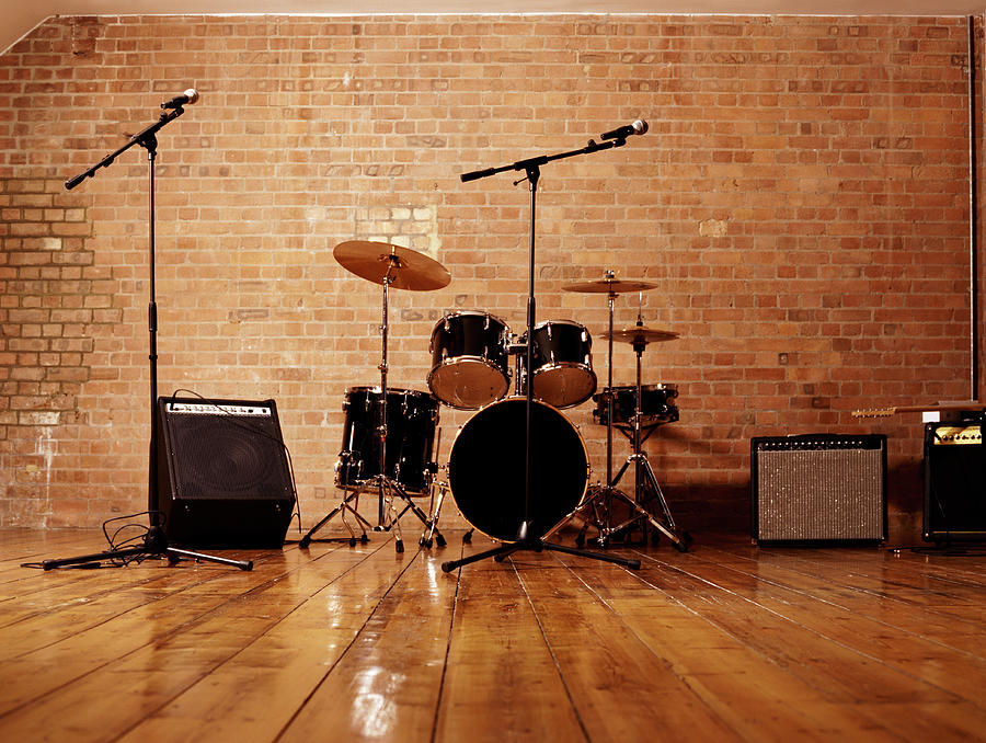 Drum Kit, Microphones And Loudspeakers Photograph by Digital Vision. Drum Kit, Microphones And Loudspeakers Photograph by Digital Vision.
