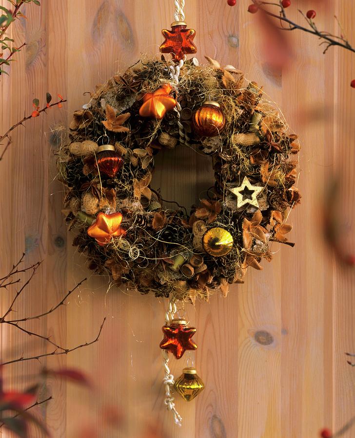 Dry Christmas Wreath Hanging On The Wall Photograph by Strauss, Friedrich