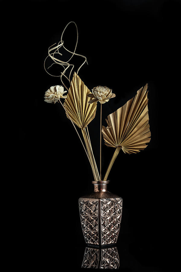 Dry flowers on a modern metal vase creating a beautiful abstract Photograph by Michalakis Ppalis