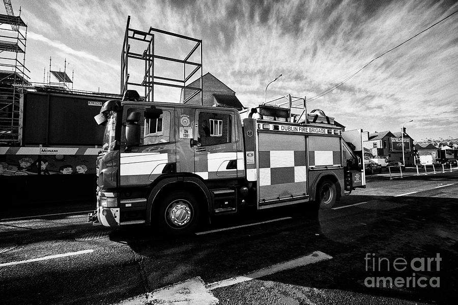 City Photograph - Dublin Fire Brigade scania emergency tender fire engine responding to a call ballybough dublin Repub by Joe Fox