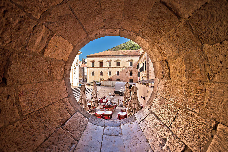 Dubrovnik historic street view through stone carved window Photograph by Brch Photography