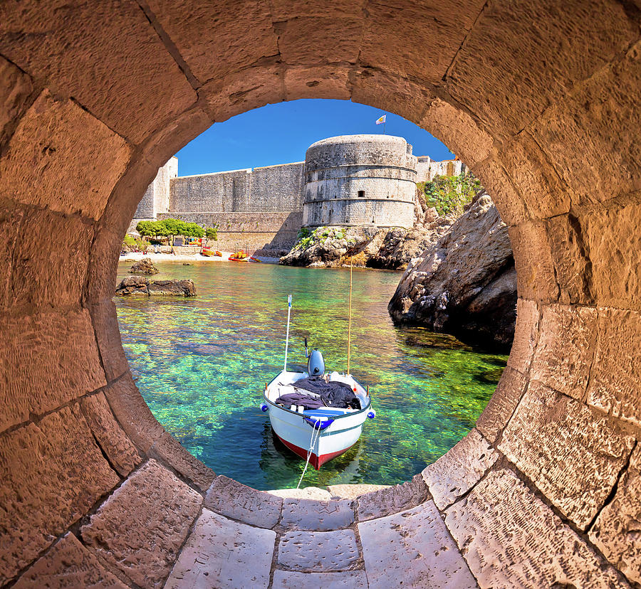 Dubrovnik small harbor under city walls view through stone carve Photograph by Brch Photography