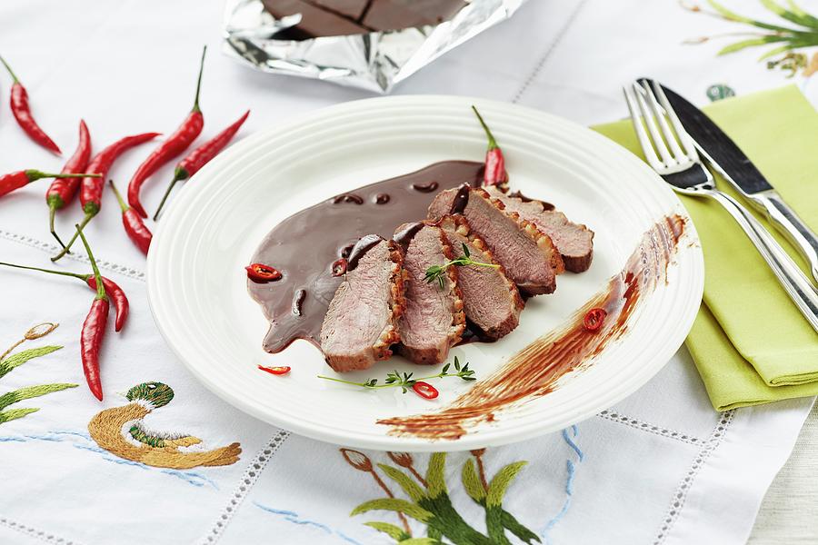 Duck Breast With A Chilli And Chocolate Sauce Photograph by Herbert Lehmann