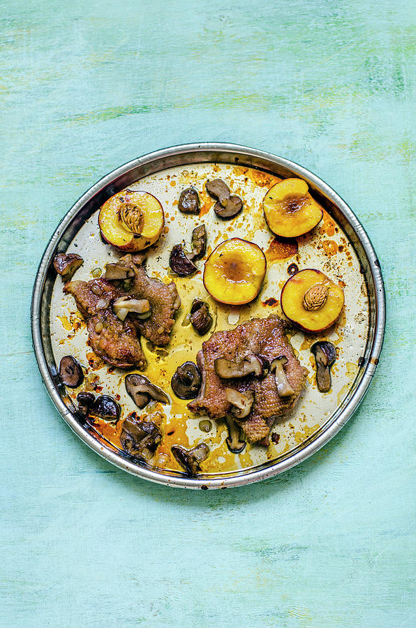 Duck Photograph - Duck Breast With Caramelized Peaches And Mushrooms On A Round Tray by Gorobina