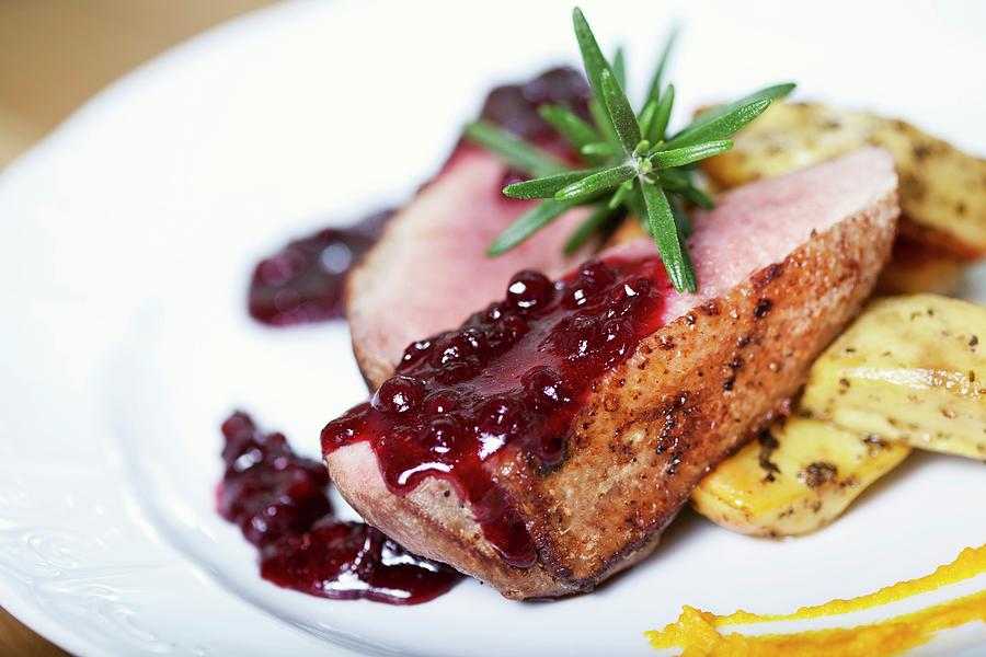 Duck Breast With Cranberry Sauce And Rosemary Photograph by Joanna Ogorek