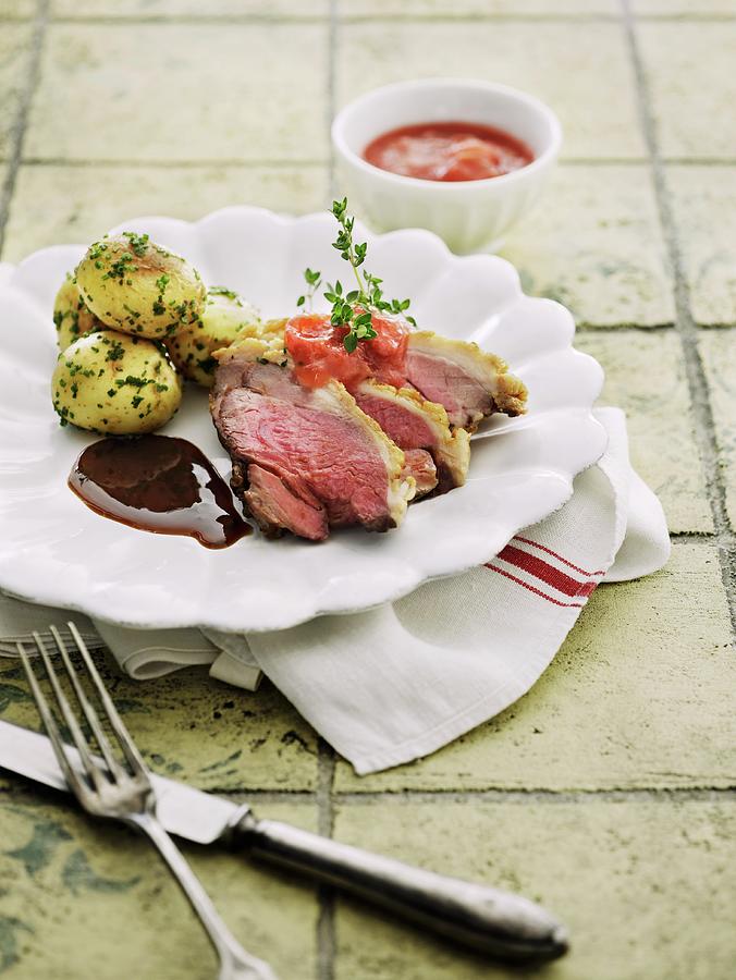 Duck Breast With Herb Potatoes Photograph by Mikkel Adsbl