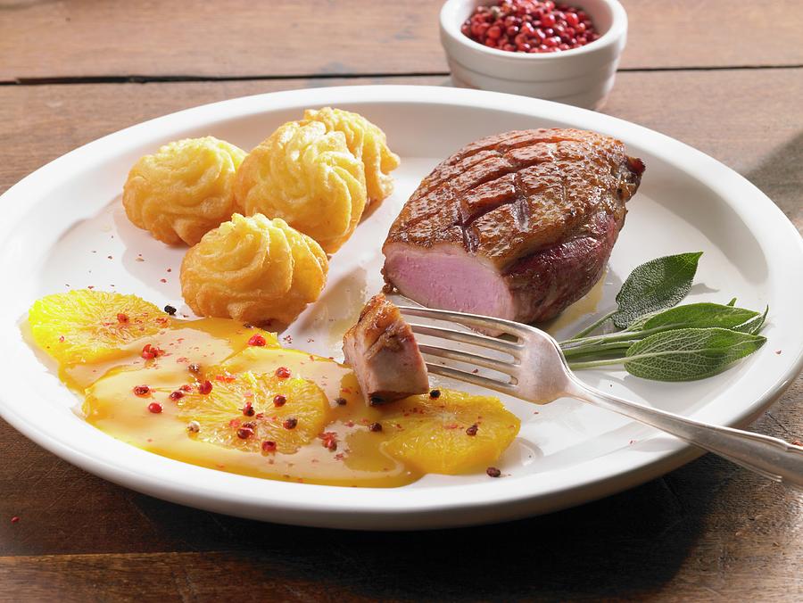 Duck Breast With Orange Sauce And Pink Peppercorns Photograph by Barbara Lutterbeck
