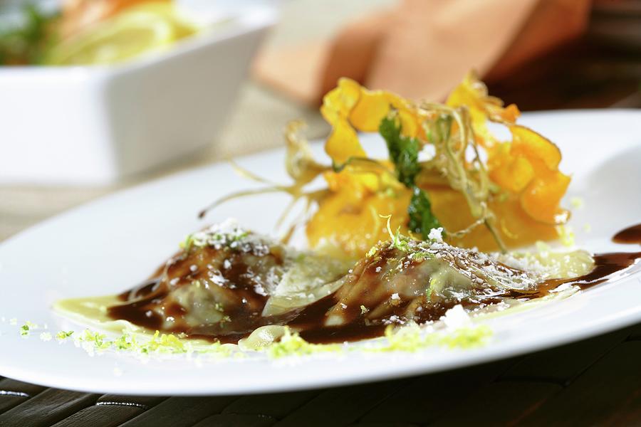 Duck Ravioli With Pumpkin Pure And Citrus Zest Photograph by Gastromedia