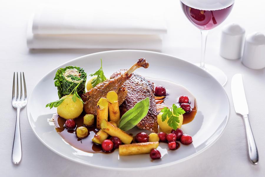 Duck With A Honey Glaze And Sauce Served With Berries, Black Salsify And Savoy Cabbage Photograph by Lukasz Zandecki