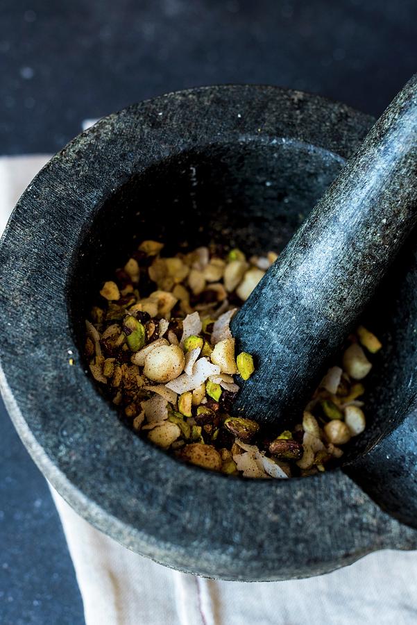 Dukkah a Nut And Spice Mix With Chocolate In A Mortar Photograph by Hein Van Tonder