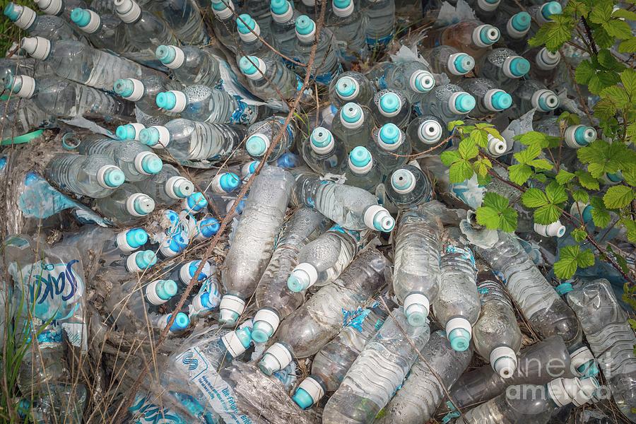Dumped Plastic Bottles. Photograph by Robert Brook/science Photo Library